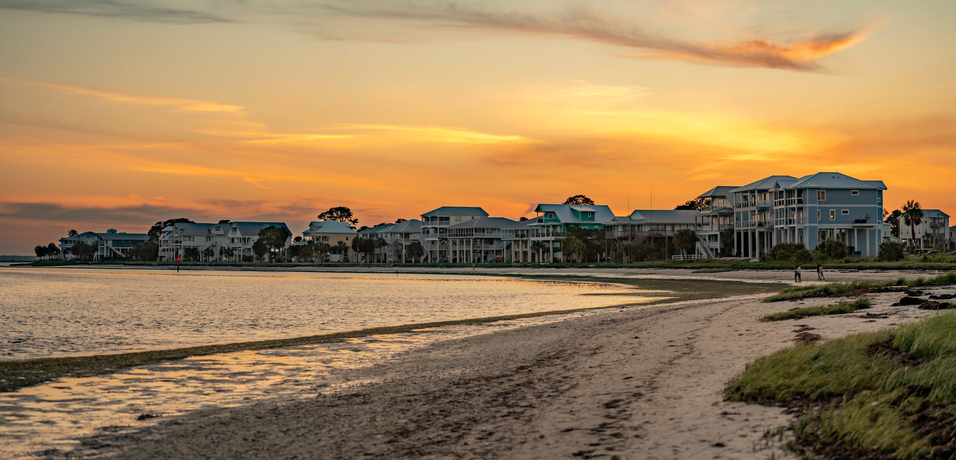 Beach houses at sunset panorama