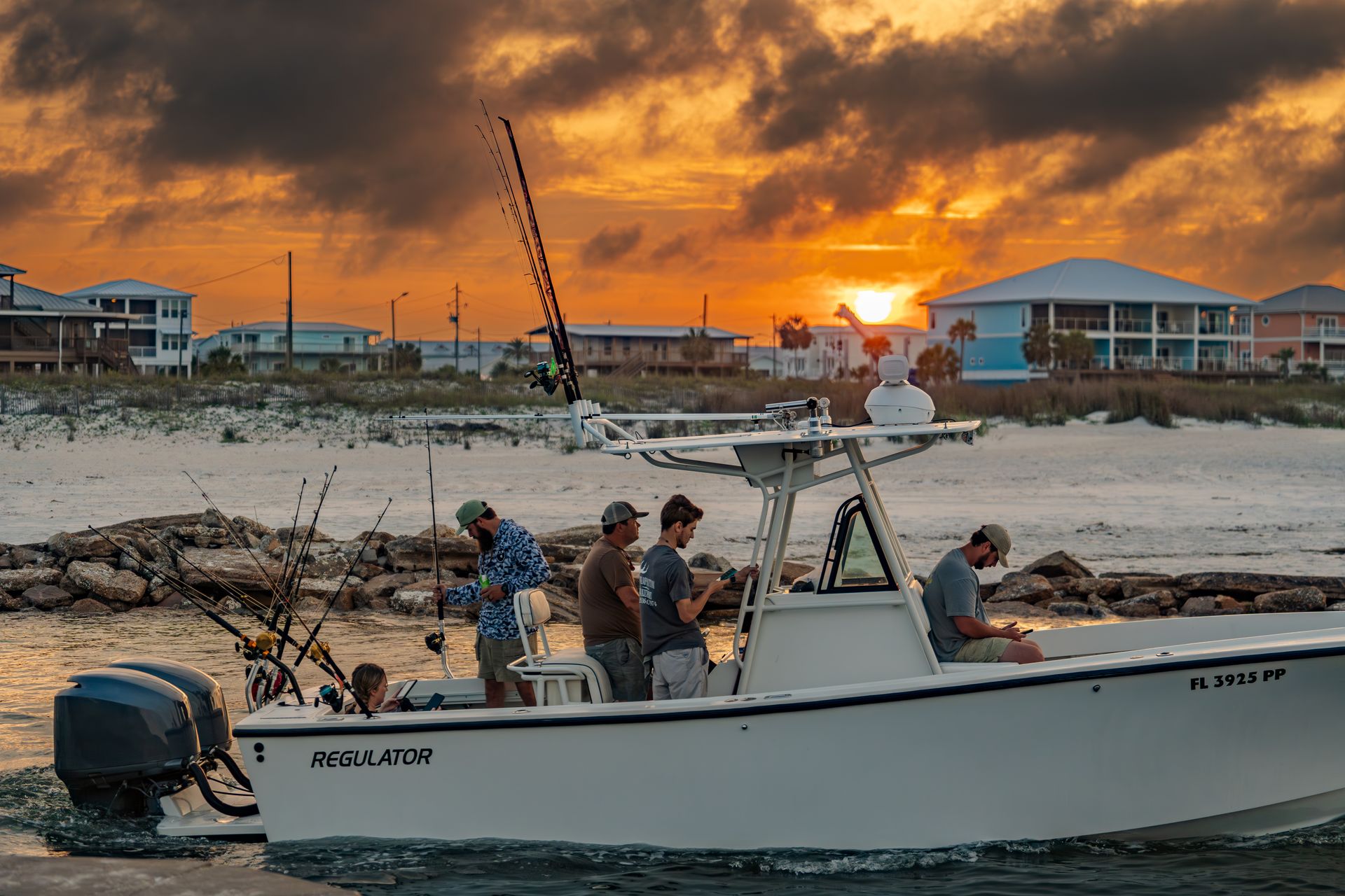 Fishing crew at sunset on Regulator boat