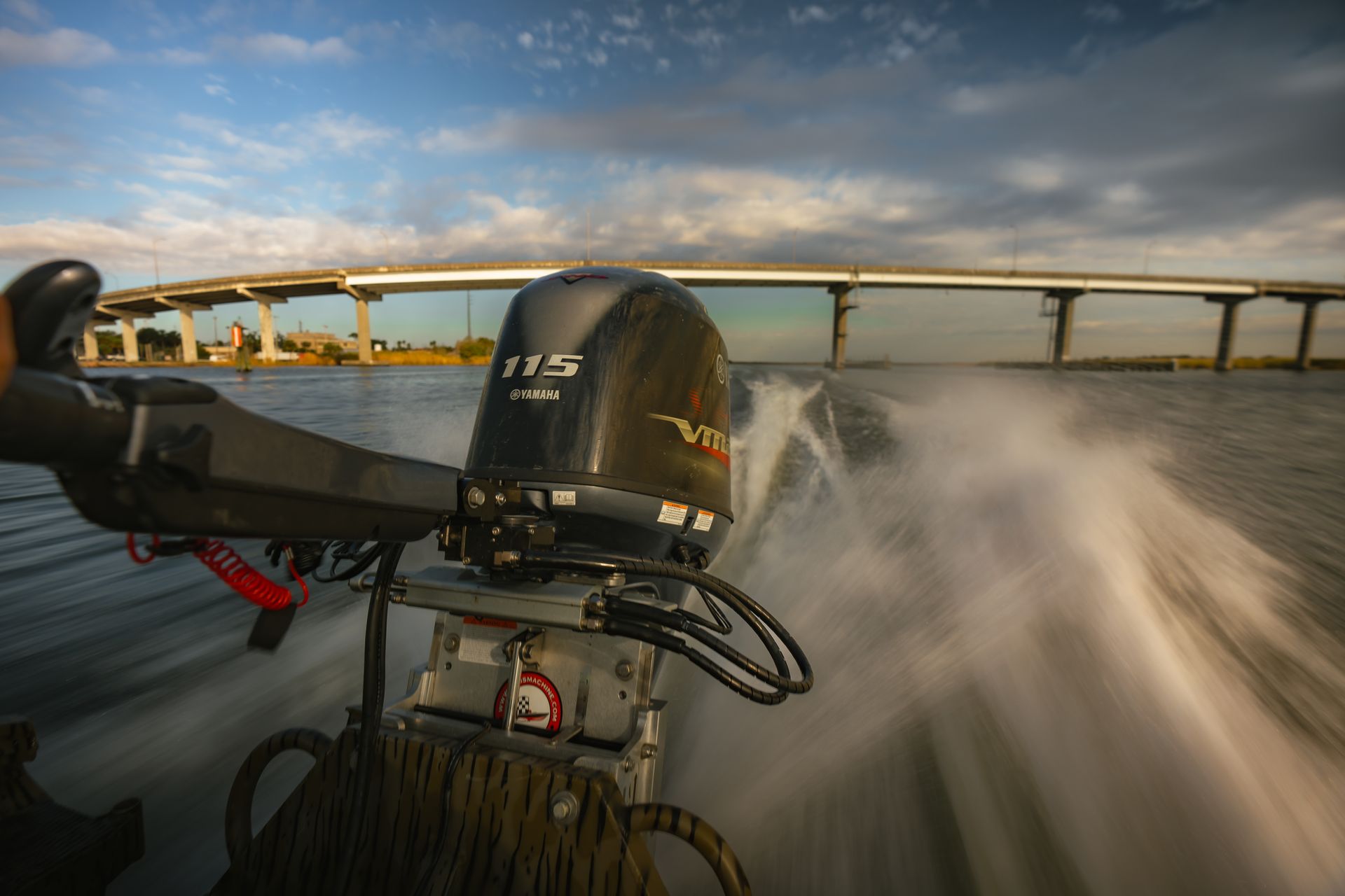 Yamaha outboard speeding under bridge